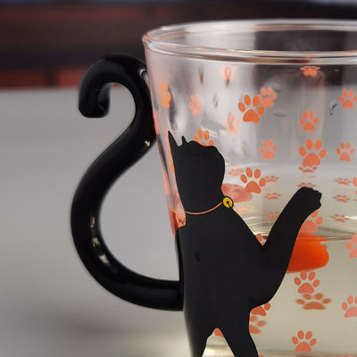 qualidade Taça de chá de vidro de gato preto de borosilicato com alça de cauda colorida fábrica
